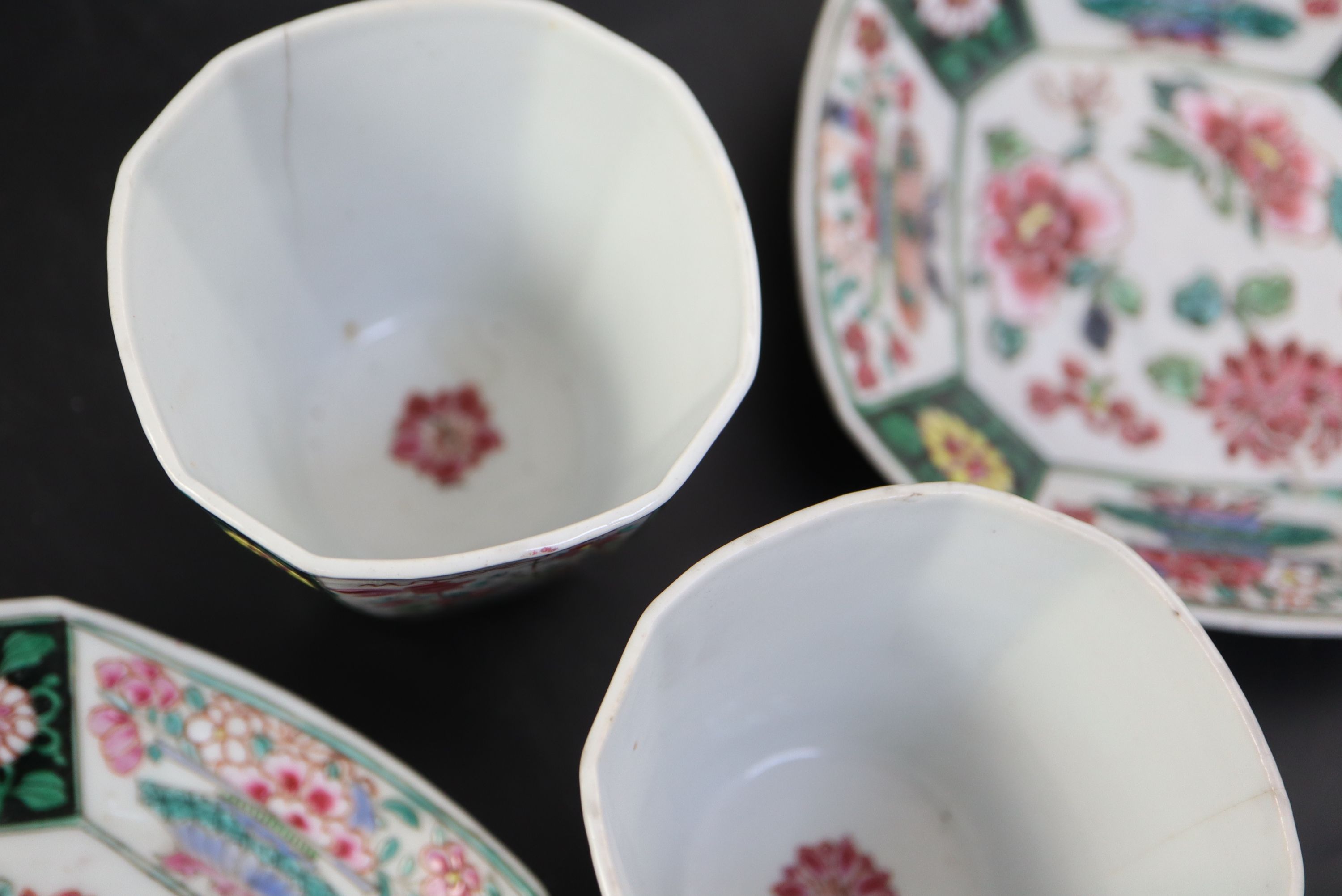 A pair of Chinese Qianlong famille rose octagonal cups and saucers, saucers 12cm cups height 6.5cm diameter 6.75cm